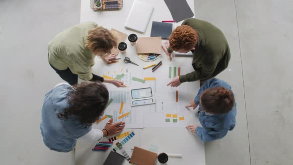 Top View of App Developers Working on Project