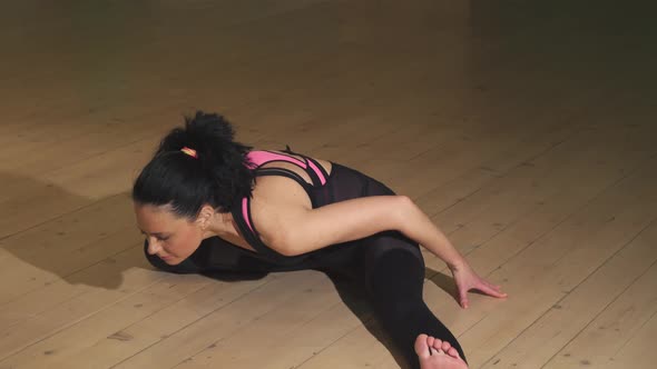 Attractive Cheerful Woman Stretching Indoors Doing Yoga