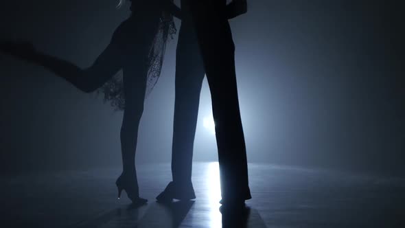 Dance Couple Demonstrating Magnificent Choreography of Cha-cha, Black Background. Close-ups