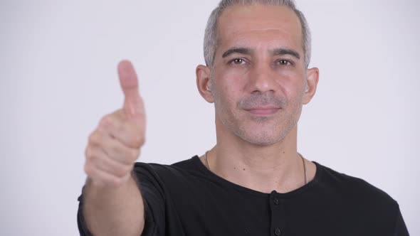 Happy Persian Man Giving Thumbs Up Against White Background