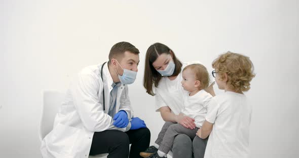 Mother with Kids on Checkup at Pediatrician Office