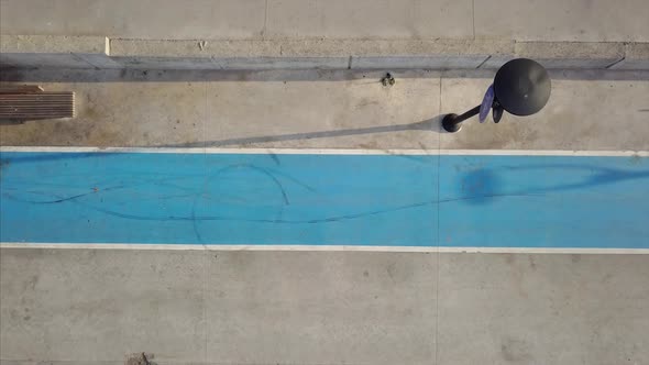 Aerial Top View Of A Man Ride A Bicycle On Bicycle Path