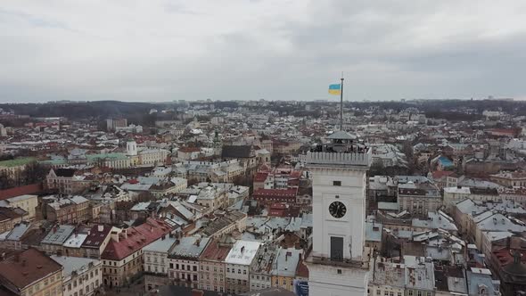 Lviv Ukraine  March 3 2020 View on Lviv City Hall with Ukrainian Flag From Drone