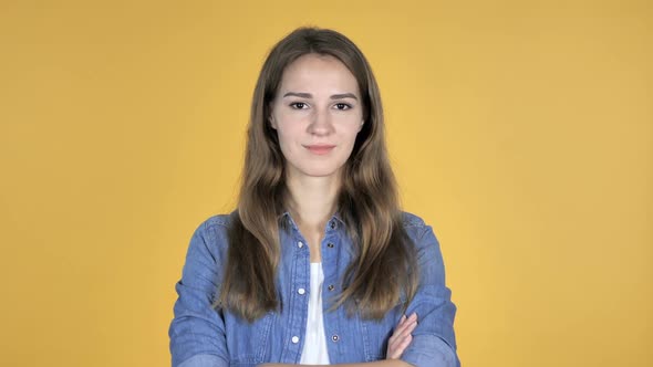 Smiling Pretty Woman Isolated on Yellow Background