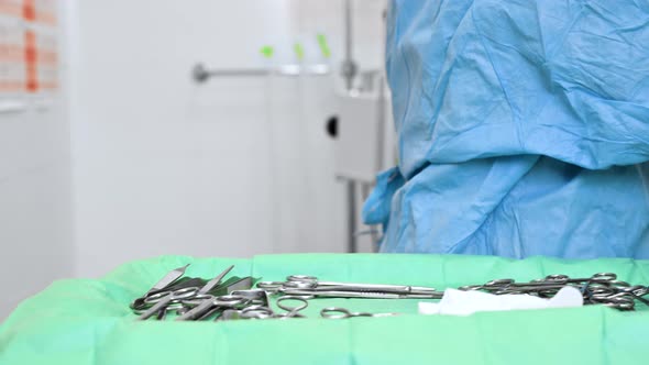 Closeup Portrait of Female Surgeon Wearing Sterile Clothing Operating at Operating Room