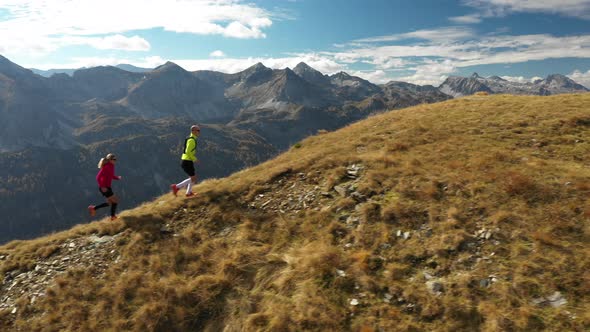 Aerial View Trail Running Couple on Mountain Ridge