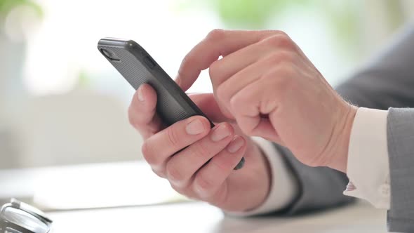 Close Up of Businessman Typing on Smartphone Mobile