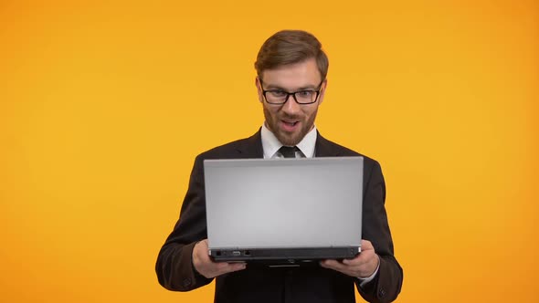 Surprised Man Reading Good News on Laptop, Online Shopping, Internet Store Sale