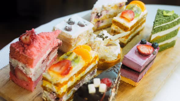 Pieces of Different Cakes on a Retrostyle Baking Tray