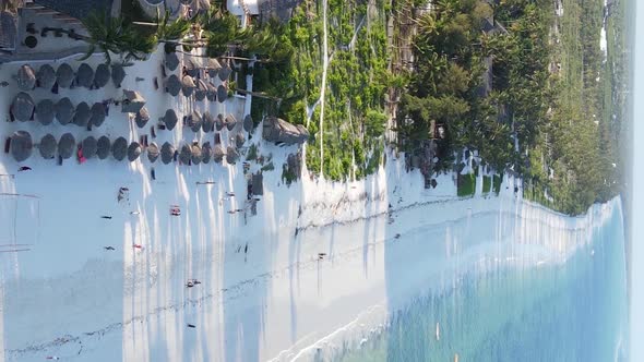 Vertical Video Boats in the Ocean Near the Coast of Zanzibar Tanzania Aerial View