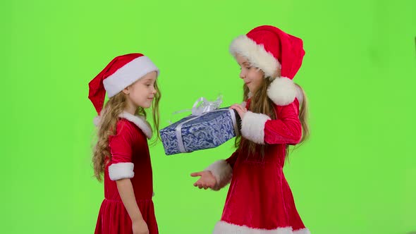 Child Gives a New Year Gift To Her Friend, Green Screen