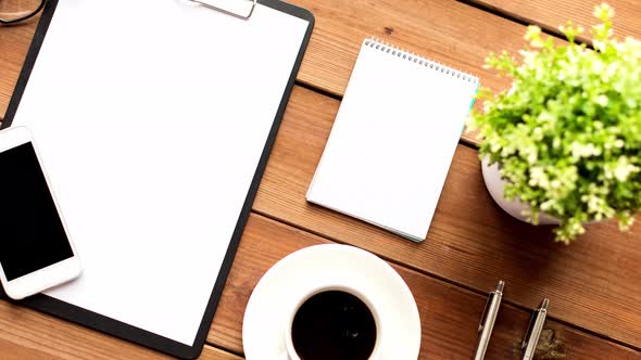 Clipboard, Smartphone, Cup of Coffee and Notebook