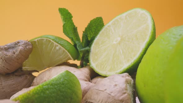 Sliced lime with fresh mint and ginger root