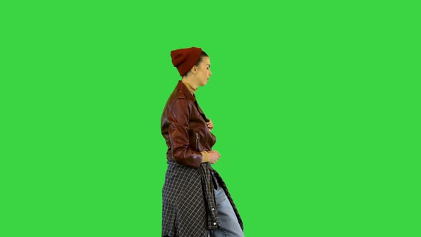 Young Girl in Urban Dance Clothes Dancing on a Green Screen Chroma Key