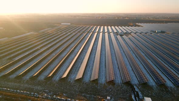 Aerial View of Solar Panels Stand in a Row in the Fields Power Ecology Innovation Nature Environment