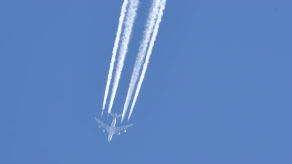 Contrails of a Four Engines Jet Airliner