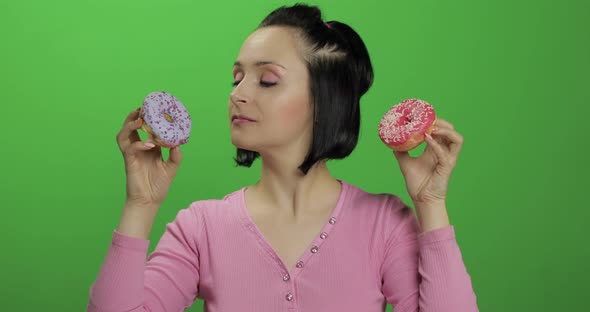 Happy Beautiful Young Girl Posing and Having Fun with Donuts. Chroma Key