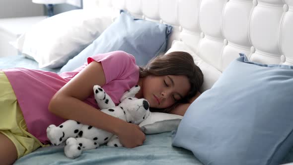 Calm Morning Sleep of Teen Girl Relax in Bed with Toy Relaxation