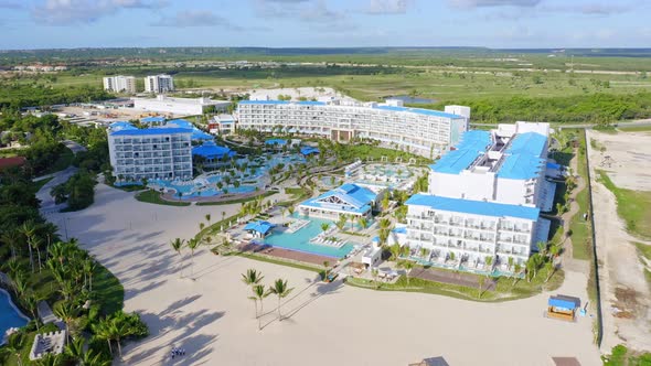 Aerial forward over Tui Blue Sensatori seafront resort complex at Cap Cana in Dominican Republic