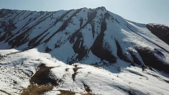 Huge Mountains Covered with Snow. Panorama of The Mountain Peaks, Blue Sky with White Clouds