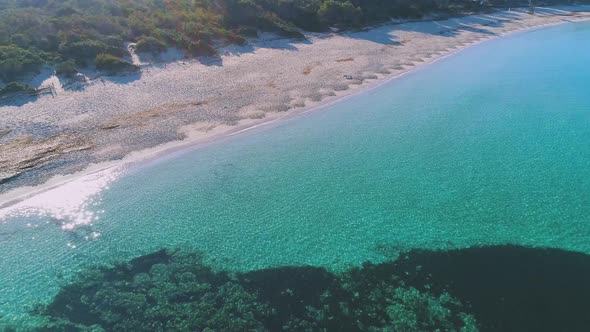 Transparent sea water near stony remote coast