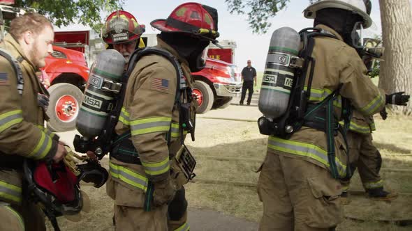 Firemen checking gear as they prepare for training