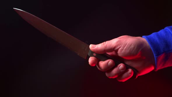 Male Hand with a Big Knife Closeup