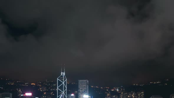 Clouds Moving Over City At Night