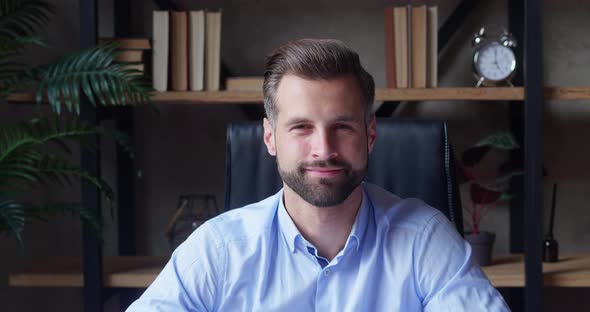 Smiling Bearded Millennial Professional Businessman Looking at Camera