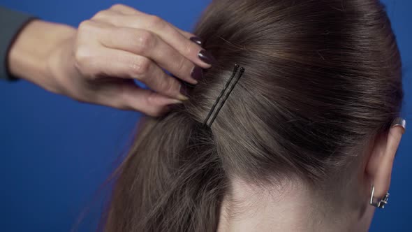 Process of Making the Hairstyle at the Hairdresser with Hairpins, Hair Stylist Makes the Hairstyle