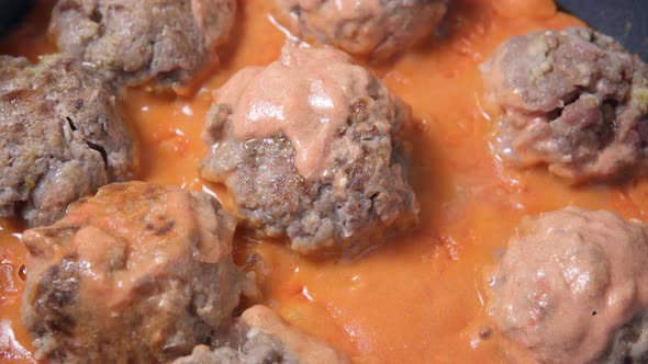 Meatballs Baked on Pan Hot Food Preparation Oven with Tomato Paste Tomatoes Onions and Spices