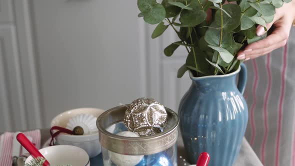 Christmas Table Decoration. Festive Table Setting. Female Hands Decorate the Table for Christmas