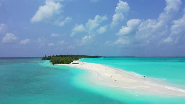 Wide angle aerial copy space shot of a sunshine white sandy paradise beach and aqua blue water backg