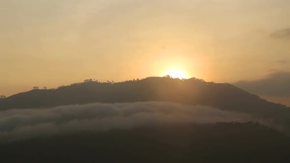 View of foggy sunrise on the Little Adam's Peak in Ella, Sri Lanka