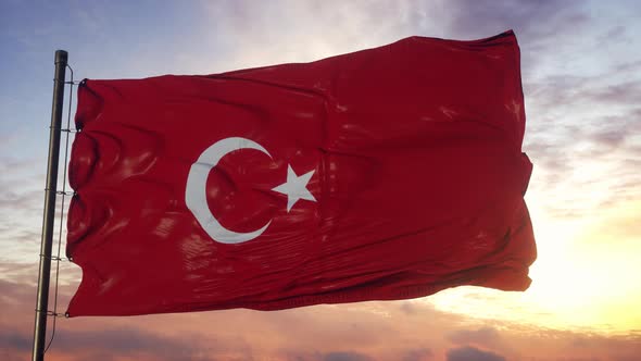 Flag of Turkey Waving in the Wind Against Deep Beautiful Sky at Sunset