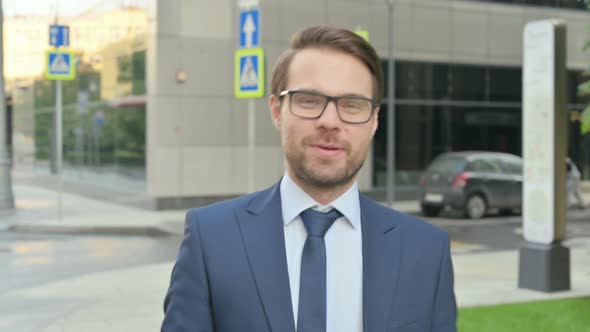 Portrait of Businessman Talking on Online Video Call Outdoor