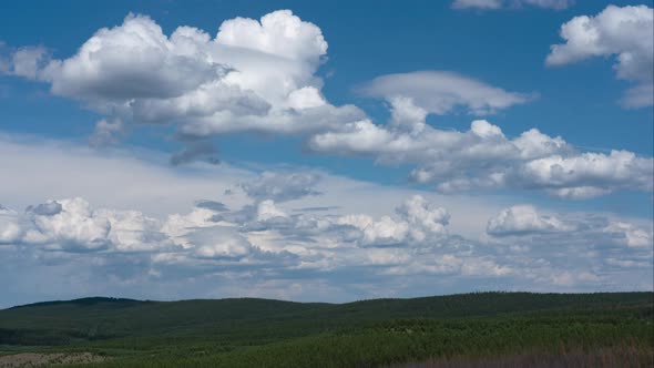 The Movement of White Cumulus Clouds