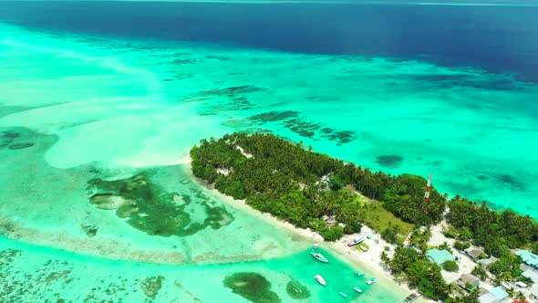 Aerial drone view landscape of tranquil island beach break by blue sea with white sand background of