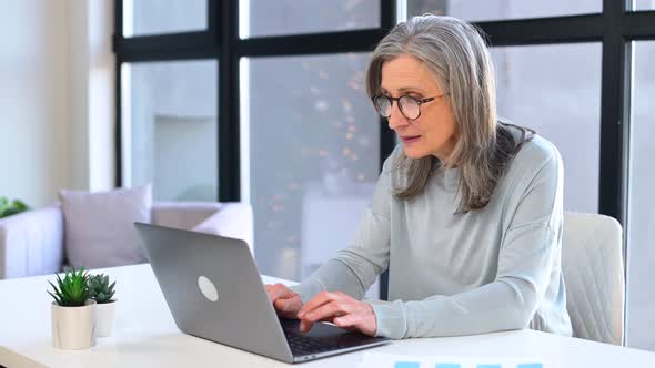 Frustrated Mature Businesswoman Made Mistake in Work