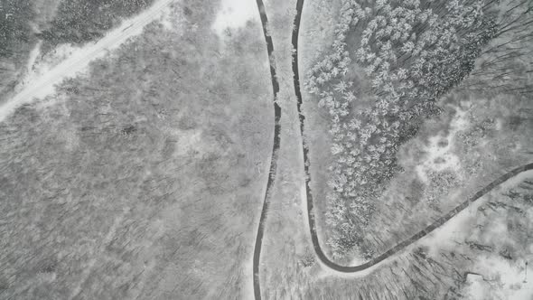 Top view of a winter curvy mountain road