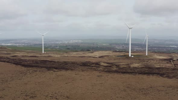 Aerial footage of wind turbines in a field