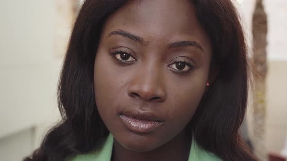 Portrait of Serious Black Woman Looking to Camera