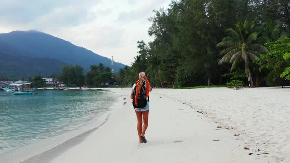 Female models look beautiful on beautiful tourist beach lifestyle by transparent sea with white sand