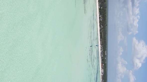 Vertical Video of the Ocean Near the Coast of Zanzibar Tanzania Aerial View