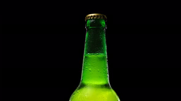 The Green Beer Bottle Spins Slowly