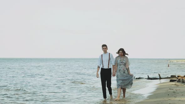 Happy Couple Together Walking Through the Beach Side They Feeling Great and Very Romantic Holding