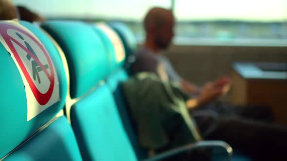 Man Passenger is Using Smartphone While Sitting at Airport Room Spbd