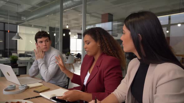 Business people discussing strategy in team meeting at corking space