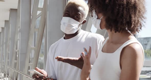 Dating and Walking During Quarantine Two Teenage Couple Wears White Medical Masks on Faces