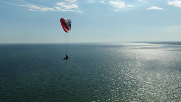 Paragliding Over the Sea, Beautiful View on the Sea Reflecting the Sunlight